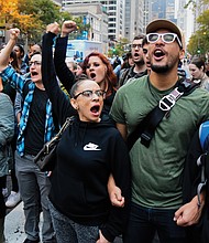 Demonstrators close down Chicago’s Michigan Avenue on Oct. 5 after a jury convicted former Chicago Police Officer Jason Van Dyke of second degree murder in the 2014 shooting death of Laquan McDonald.