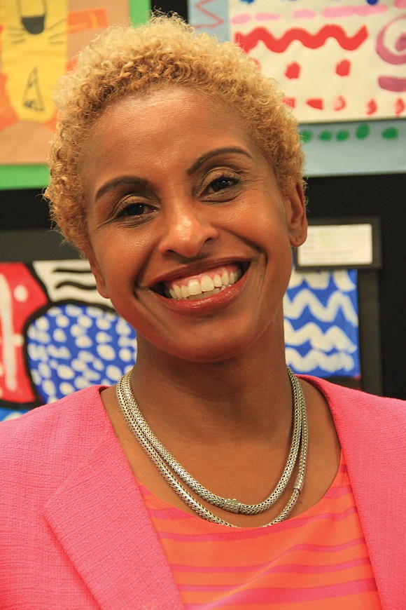 Monica Manns keeps certain books within arm’s reach of her desk at the Henrico County Public Schools central office.