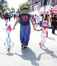 Jessica Couser and her daughter, Riley, 4, enjoy the music and the art along with families and people of all ages at the 2nd Street Festival. (Regina H. Boone/Richmond Free Press)