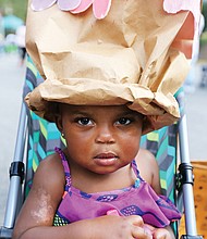 She’s got the look: Daziyah Hewlett shows off the fancy crown she and her mom, Johanna Whitaker, created last Saturday at the 30th Annual 2nd Street Festival in Jackson Ward. The free two-day event, highlighted by music, food, history and culture, also included a Kidz Zone with special activities run by the Children’s Museum of Richmond. (Regina H. Boone/Richmond Free Press)