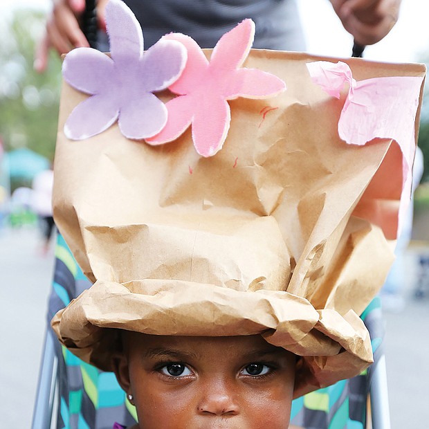 She’s got the look: Daziyah Hewlett shows off the fancy crown she and her mom, Johanna Whitaker, created last Saturday at the 30th Annual 2nd Street Festival in Jackson Ward. The free two-day event, highlighted by music, food, history and culture, also included a Kidz Zone with special activities run by the Children’s Museum of Richmond. (Regina H. Boone/Richmond Free Press)