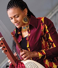 Sona Jobarteh of Gambia is one of the first female virtuosos on the 21-string kora, an instrument played mostly in West Africa. Richmond’s riverfront was alive with music last weekend for the 14th Annual Richmond Folk Festival. Thousands of people flocked to the free, three-day festival where more than 30 performers and entertainers from around the globe were on seven stages. (Sandra Sellars/Richmond Free Press)