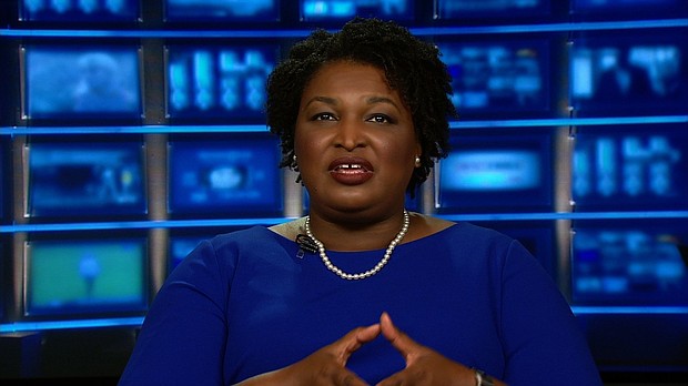 Long before she became the Democratic candidate for Georgia governor, Stacey Abrams participated in a flag-burning protest on the steps of the Georgia Capitol in 1992, The New York Times reported Monday. At the time, the flag included the Confederate battle flag emblem.