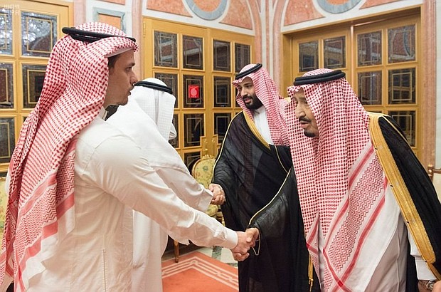 Saudi Crown Prince Mohammed bin Salman and his father King Salman shake hands with Salah bin Jamal Khashoggi, the journalist's eldest son, and another relative, in Riyadh.