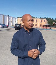 Richmond City Councilman Michael J. Jones stands in front of the Southside Community Center on Old Warwick Road as he talks up his plan to rename the 18-acre city property for Lonnie Battle, a popular local DJ known professionally as DJ Lonnie B.