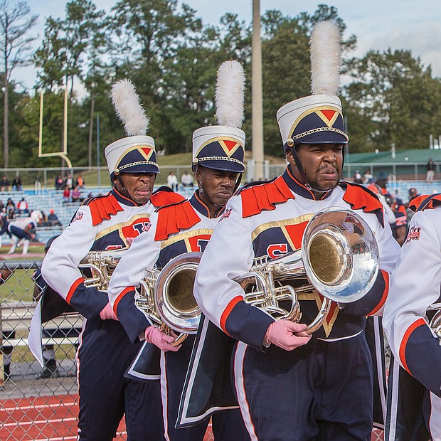 Hundreds of old friends, classmates and their families reunited at Virginia State University last weekend to celebrate homecoming 2018. Members of the VSU Trojan Explosion Marching Band march in focused formation during the game. (James Haskins/Richmond Free Press)