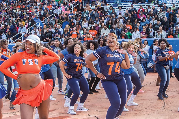 Hundreds of old friends, classmates and their families reunited at Virginia State University last weekend to celebrate homecoming 2018. VSU’s renowned cheerleaders pep up the crowd with a few moves. (James Haskins/Richmond Free Press)