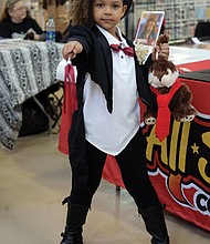 I put a spell on you: Wands, rabbits and other tricks are just the tip of the iceberg for Violette Brown. No, she wasn’t dressed for Halloween. She was dressed for 2018 VA Comicon, a two-day event held last weekend at the Richmond Raceway. (Sandra Sellars/Richmond Free Press)