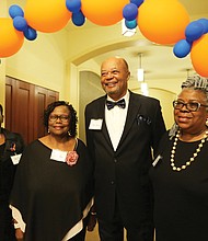 Golden memories: Members of the Armstrong High School Class of 1968 celebrate their 50th reunion at a dinner-dance Oct. 20 at Lewis Ginter Botanical Garden in Henrico. The three-day reunion brought back fond memories and memorabilia from class members. Pausing for a group photo under a balloon arch with the school colors are, from left, Alma Campbell Gates and Sylvia Harris; Calvin Twyman, who served as president of the class in 1968; and Elnora Hicks Allen. (Regina H. Boone/Richmond Free Press)