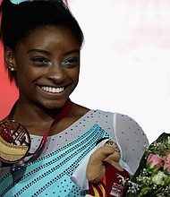 Simone Biles competes in the Women’s All-Round Final during day eight of the 2018 FIG Artistic Gymnastics Championships at Aspire Dome on November 1, 2018 in Doha, Qatar. (photo via cnn.com)