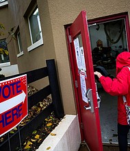 A woman arrives to vote at Philomont Fire Station, in Purcellville, Virginia