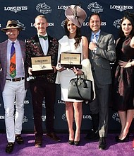 Mattias Dylan Horseman, center left, of Austin, Texas, and McKenzie Marcinek, center right, of Lexington, Kentucky, pose with judges Jane Motion, daughter of Kentucky Derby-winning trainer Graham Motion, TV personality Carson Kressley, Pascal Savoy, Brand President for Longines U.S., Bri Mott, of Fashion at the Races, and Sophie Flay, daughter of Bobby Flay, after they won the Longines Prize for Elegance contest at the 2018 Breeders' Cup, Saturday, Nov. 3, 2018, at Churchill Downs in Louisville, KY.