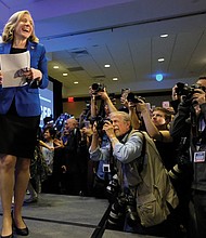 Democrat Abigail Spanberger of Henrico heads to the podium late Tuesday night to claim a razor-thin victory in the 7th Congressional District contest against incumbent GOP Rep. Dave Brat.