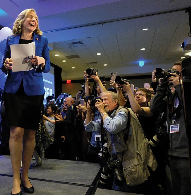 Democrat Abigail Spanberger of Henrico heads to the podium late Tuesday night to claim a razor-thin victory in the 7th Congressional District contest against incumbent GOP Rep. Dave Brat.