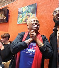 Cheryl L. Burke beams with excitement as she watches the election results roll in Tuesday night at a victory party with family, friends and supporters at a restaurant in Shockoe Bottom.