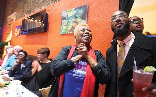 Cheryl L. Burke beams with excitement as she watches the election results roll in Tuesday night at a victory party with family, friends and supporters at a restaurant in Shockoe Bottom.