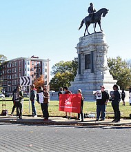 Point, counterpoint: About 20 neo-Confederates with the CSA II: New Confederate States of America and the Virginia Task Force 3 Percenters-Dixie Defenders were met with a like number of counterprotesters last Saturday at the statue of Confederate Gen. Robert E. Lee on Monument Avenue. (Regina H. Boone/Richmond Free Press)