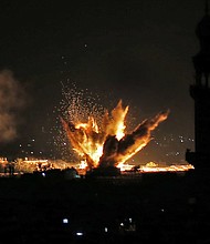 Fire and smoke billow following Israeli air strikes targeting Rafah in the southern Gaza Strip.