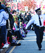 Chief Durham waves to the crowd as he takes part in Richmond’s 2015 Christmas Parade. In typical fashion, he is walking, rather than riding, along the two-mile route.