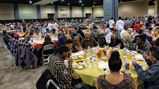 Thousands of people enjoy last year’s Thanksgiving feast put on by The Giving Heart at the Greater Richmond Convention Center that is open to the Richmond community.