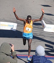 Boaz Kipyego of Kenya crosses the finish line near Brown’s Island last Saturday to win the 41st Annual Richmond Marathon. He finished the 26.2 mile race in 2:20:44, taking home the $2,500 prize.
