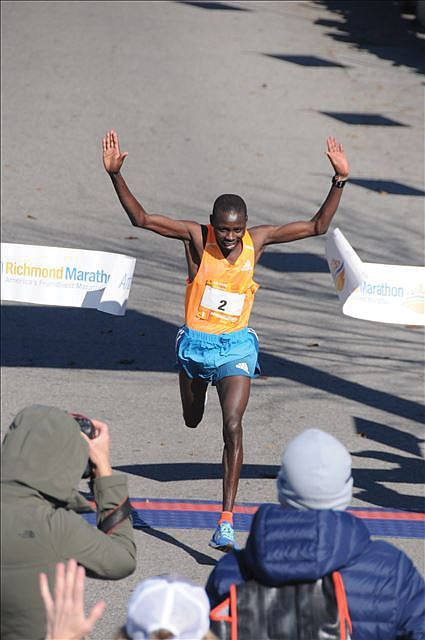 Boaz Kipyego of Kenya crosses the finish line near Brown’s Island last Saturday to win the 41st Annual Richmond Marathon. He finished the 26.2 mile race in 2:20:44, taking home the $2,500 prize.