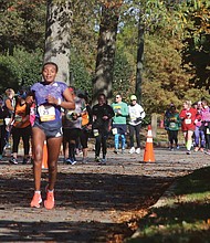 Bose Gemeda Asseta of Ethiopia leads the women’s race as she makes her way along Brook Road at the 23-mile mark during last Saturday’s Richmond Marathon. Ms. Asseta went on to be the top women’s finisher with a time of 2:39:04.