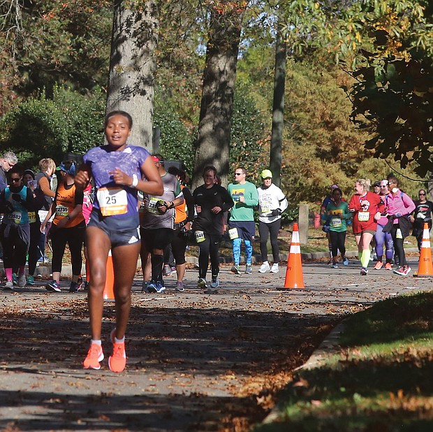 Bose Gemeda Asseta of Ethiopia leads the women’s race as she makes her way along Brook Road at the 23-mile mark during last Saturday’s Richmond Marathon. Ms. Asseta went on to be the top women’s finisher with a time of 2:39:04.