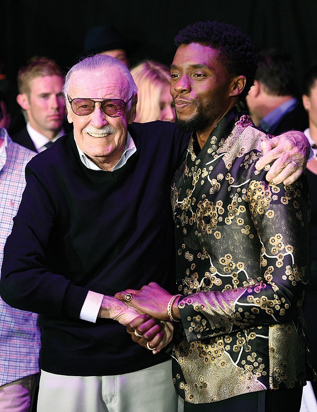 Comic book artist, Stan Lee, left, creator of the “Black Panther” superhero character, greets actor and star of the “Black Panther” movie Chadwick Boseman at the film’s Jan. 29 premiere at The Dolby Theatre in Los Angeles.