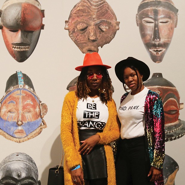 Night at the museum: It was “Love, Peace and Soul Saturday” last weekend at the Virginia Museum of Fine Arts and dozens of people enjoyed the evening of music, dancing and food as they wandered through the galleries perusing the 130 pieces in the newest exhibit, “Congo Masks: Masterpieces from Central Africa.” Above, Chalsea Freeman of Chesapeake, left, and Shakeyla Bell of Chester pause at the entrance of the exhibition. The exhibit will be on view through Feb. 24. (Regina H. Boone/Richmond Free Press )