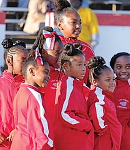Poised and ready: Cheerleaders with the Reid Community Center Ravens strike a pose after cheering for their football teams playing in the Richmond Parks, Recreation and Community Facilities football championship games last Saturday at City Stadium. (Sandra Sellars/Richmond Free Press)