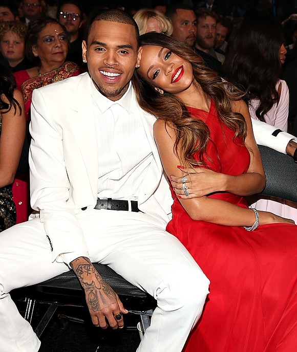 Apparently risqué photos of Rihanna are enough to grab Chris Brown's attention.