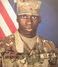 File photo of Emantic Fitzgerald Bradford Jr., known as E.J., dressed in basic training Army fatigues. The photo was released by the family attorney, Benjamin L. Crump. Bradford Jr. said on his Facebook page he was a US Army combat engineer. An Army spokesman told CNN he never completed advanced individual training and did not officially serve in the Army.
