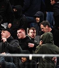 Ajax supporters were left bloodied in clashes before the team's game at AEK Athens in the Champions League.