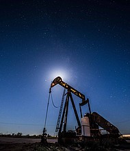 US crude oil fell below $50 a barrel Thursday for the first time in more than a year.