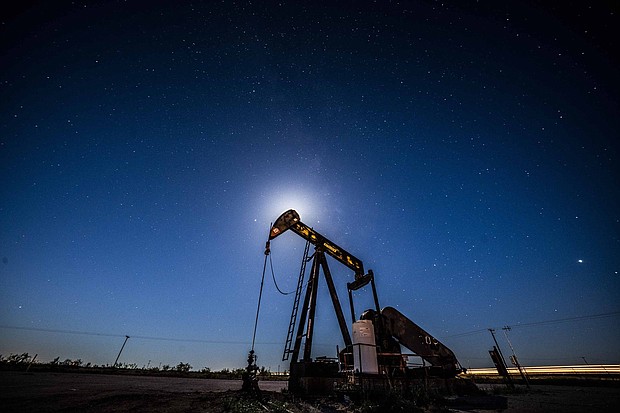 US crude oil fell below $50 a barrel Thursday for the first time in more than a year.