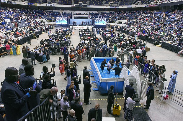 The Richmond Coliseum is packed for a baptism ceremony during a Jehovah’s Witness Convention in July 2015. The denomination’s annual conventions drew thousands of people for several consecutive weekends each summer to the Downtown venue until they were moved this year to the Greater Richmond Convention Center.