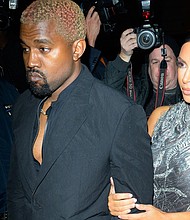 Kanye West and Kim Kardashian West arrive Monday night at "The Cher Show" on Broadway.