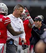 Urban Meyer smiles with wide receiver Parris Campbell during the Michigan game last month.