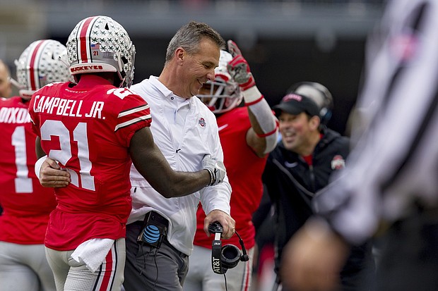 Urban Meyer smiles with wide receiver Parris Campbell during the Michigan game last month.
