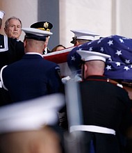 Former U.S. President George W. Bush watches the casket of former U.S. President George H.W. Bush arrive at the U.S Capitol on December 03, 2018 in Washington, DC.
