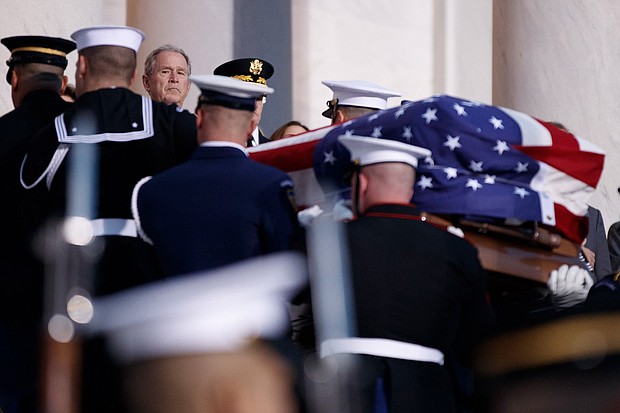 Former U.S. President George W. Bush watches the casket of former U.S. President George H.W. Bush arrive at the U.S Capitol on December 03, 2018 in Washington, DC.
