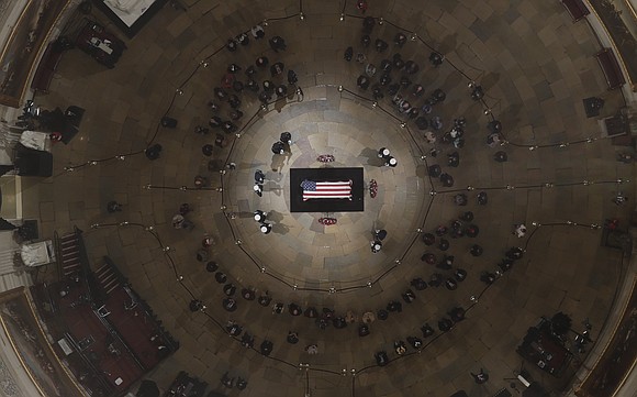 Amid the long lines of people waiting in the Capitol Rotunda to pay their respects to former President George H.W. …