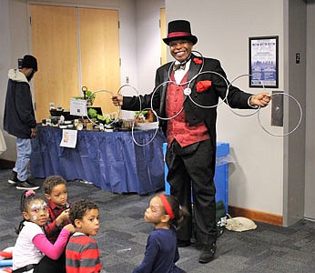 Magician John Carrington entertains Dean, Reagan, Cole and Sydney.