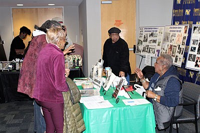 Rambling Rose and “Shorty” talk to customers about her books