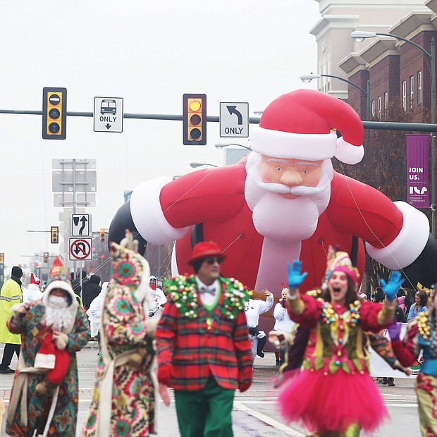 Holiday cheer: Thousands of spectators turned out last Saturday for the 35th Annual Christmas Parade in Richmond. Dozens of huge balloon characters, floats, marching bands and Santa made their way along Broad Street from the Science Museum of Virginia east to the Richmond Coliseum in Downtown to the smiles and cheers of people of all ages. (Regina H. Boone/Richmond Free Press)