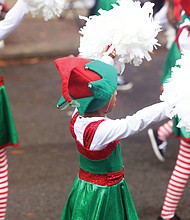 Holiday cheer: Thousands of spectators turned out last Saturday for the 35th Annual Christmas Parade in Richmond. Dozens of huge balloon characters, floats, marching bands and Santa made their way along Broad Street from the Science Museum of Virginia east to the Richmond Coliseum in Downtown to the smiles and cheers of people of all ages. (Regina H. Boone/Richmond Free Press)