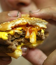 McDonald's says it will reduce the use of antibiotics in its beef around the world.