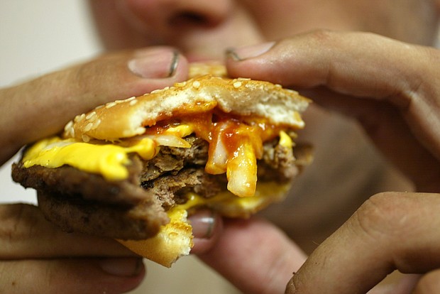 McDonald's says it will reduce the use of antibiotics in its beef around the world.
