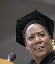 Virginia Commonwealth University fall commencement speaker Christy Coleman offers graduates words of advice during a ceremony last Saturday at the Siegel Center. Left, graduates celebrate their new degrees during the ceremony.